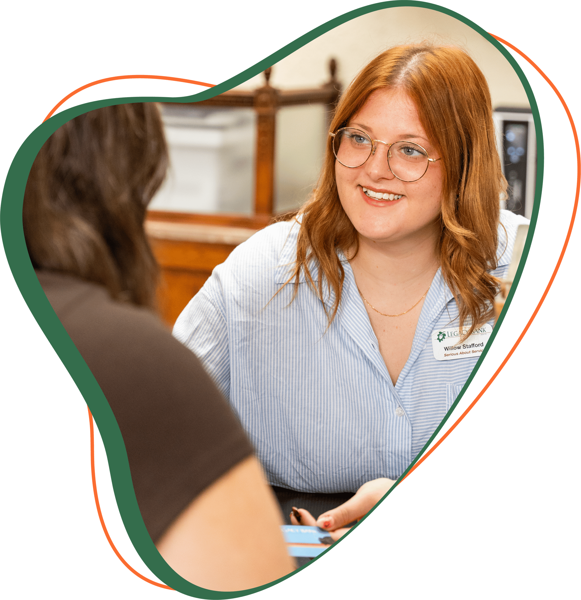 Legacy Bank Employee, Willow, smiling at a client.