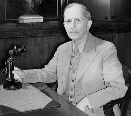 Man sitting with old telephone
