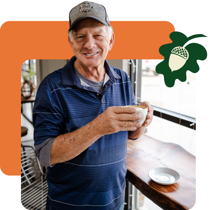 Older man holding a cup of coffee
