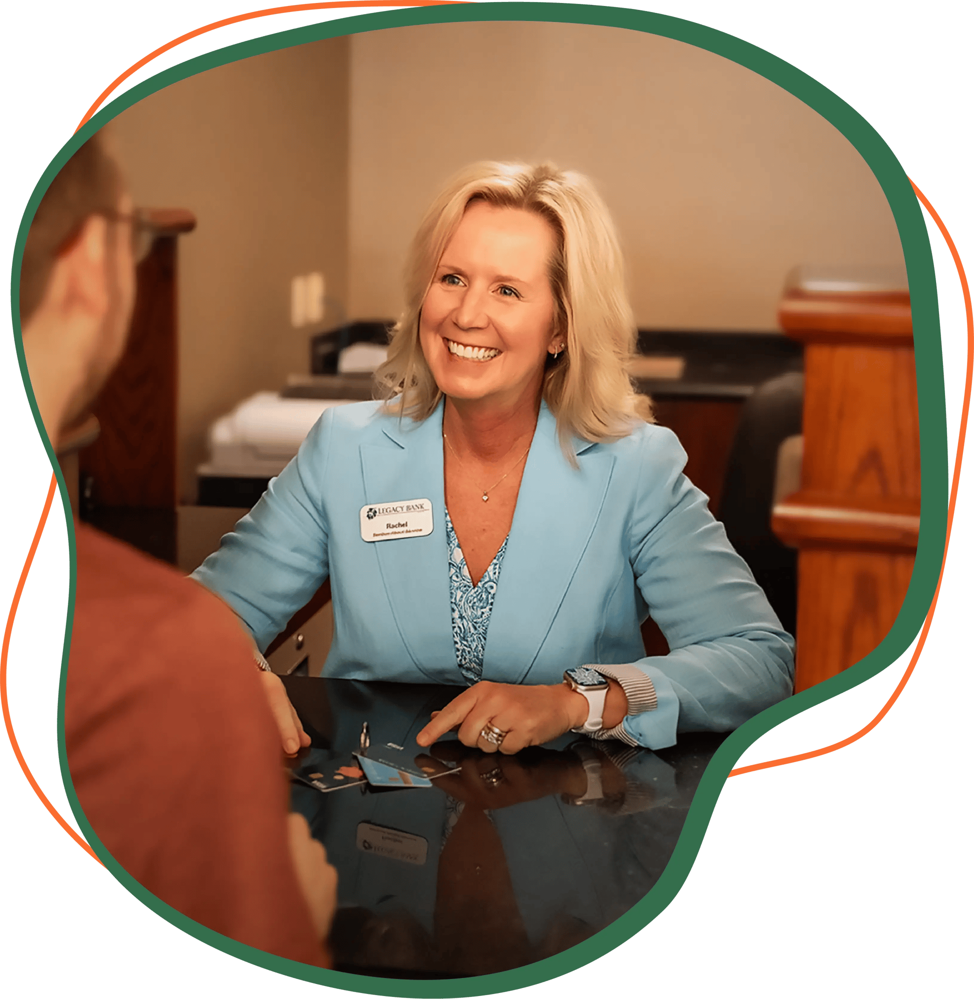 Banking Teller talking with a customer